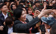 BANGKOK, May 7, 2014 (Xinhua) -- Thai caretaker Prime Minister Yingluck Shinawatra (C) greets supporters after a press conference in Bangkok, Thailand, May 7, 2014. 