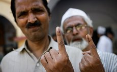 VARANASI, May 12, 2014 (Xinhua) -- People show their marked fingers after casting their votes at a polling station in Varanasi, Uttar Pradesh state, India, May 12, 2014. 