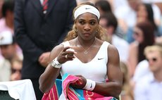 LONDON, June 26, 2014 (Xinhua) -- U.S. player Serena Williams rests during the women's singles second round match against South Africa's Chanelle Scheepers at the 2014 Wimbledon Championships 