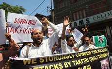 SRINAGAR, June 27, 2014 (Xinhua) -- Kashmiri Shiite Muslims shout slogans during a protest against Islamic State of Iraq and the Levant (ISIL) in Srinagar, summer capital of Indian-controlled Kashmir