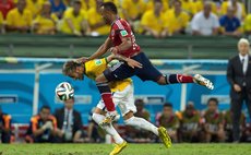 FORTALEZA, July 5, 2014 (Xinhua) -- Brazil's Neymar (L) is fouled by Juan Camilo Zuniga of Colombia during the quarterfinal match between Brazil and Colombia of 2014 Brazil FIFA World Cup 