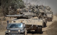 GAZA BORDER, Aug. 2, 2014 (Xinhua) -- Israeli Merkava tanks run in southern Israel near the border with Gaza Strip, on Aug. 1, 2014. 