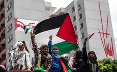 CARACAS, Aug. 2, 2014 (Xinhua) -- Venezuelans participate in a demonstration against Israeli offensive on Gaza Strip, in Caracas city, Venezuela, on Aug. 2, 2014