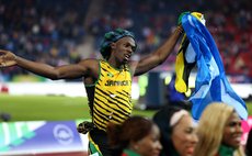 GLASGOW, Aug. 3, 2014 (Xinhua) -- Usain Bolt of Jamaica reacts after the men's 4X100m relay final of Athletics at the 2014 Glasgow Commonwealth Games, Scotland on Aug. 2, 2014. 