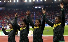 GLASGOW, Aug. 3, 2014 (Xinhua) -- Athletes of Jamaica react during the awarding ceremony for the men's 4X100m relay final of Athletics at the 2014 Glasgow Commonwealth Games 