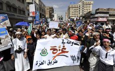 SANAA, Aug. 9, 2014 (Xinhua) -- Yemeni protesters shout slogans during a protest against Israeli offensive on Gaza Strip in Sanaa, Yemen, on August 9, 2014. 