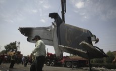 TEHRAN, Aug. 10, 2014 (Xinhua) -- The wreckage of a plane which crashed near Tehran is collected by rescuers on Aug. 10, 2014