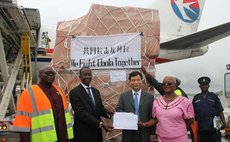 FREETOWN, Aug. 11, 2014 (Xinhua) -- Chinese Ambassador to Sierra Leone Zhao Yanbo (2nd R, front), attend a transferring ceremony at the airport in Freetown, capital of Sierra Leone, Aug. 11, 2014.