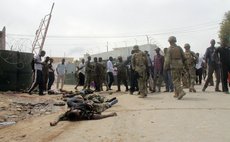 MOGADISHU, Sept. 1, 2014 (Xinhua) -- Bodies of suspected Al Shabaab militants lay on the ground after a bomb explosion in Mogadishu, capital of Somalia, Aug. 31, 2014. 