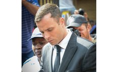 PRETORIA, Oct. 13, 2014 (Xinhua) -- Oscar Pistorius leaves the North Gauteng High Court in Pretoria, South Africa, on Oct. 13, 2014