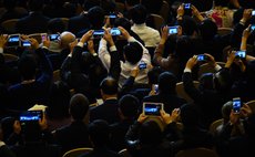 BEIJING, Nov. 10, 2014 (Xinhua) -- Guests take pictures of U.S. President Barack Obama delivering a keynote speech at the 2014 APEC Summit in Beijing, capital of China, Nov. 10, 2014. 