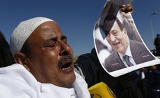 CAIRO, Nov. 29, 2014 (Xinhua) -- A supporter of former Egyptian president Hosni Mubarak celebrates verdict of his trial outside a police academy in Cairo, Egypt, Nov. 29, 2014. 