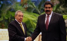 HAVANA, Dec. 14, 2014 (Xinhua) -- Cuban President Raul Castro (L) with his Venezuelan counterpart Nicolas Maduro during the 13th Summit of ALBA in Havana, Cuba, on Dec. 14, 2014.