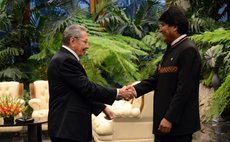 HAVANA, Dec. 14, 2014 (Xinhua) -- Cuban President Raul Castro (L) shakes hands Bolivian counterpart Evo Morales during the 13th Summit of ALBA in Havana, Cuba, on Dec. 14, 2014. 