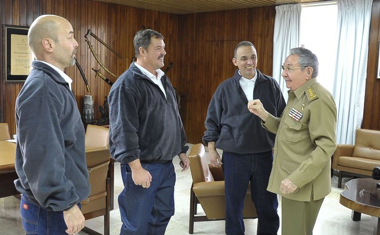 Cuban President Raul Castro (1st R) talking with three of the Cuban agents called The Five, released by the United States of America, in Havana, Cuba. 