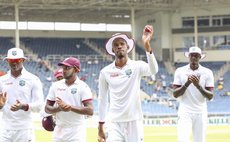 Chase leads WI team off the field after taking a five-for