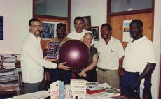 Ron Green (L), then Minister for Education, Youth & Sports, accompanied by DOC and Sports Officials, receiving sports equipment from Dr. Jenny Allport