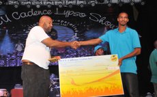 NCCU president Dexter Ducreay ,left, shakes hands with Anton Joseph, winner of the 4th Cadencelypso competition