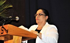 Giving her school's report at the 2017 graduation, principal Alicia JeanJacques