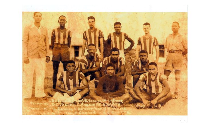 Coriette, standing third from left, and members of his team