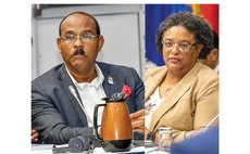 In photo Antigua's Browne and Barbados's Mortley