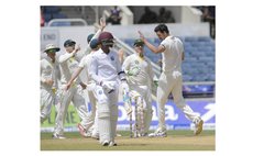 Australia celebrate at the end of the West Indies innings