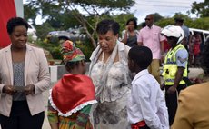 Baroness Patricia Scotland speaks with pupils of the Baroness Scotland primary School in Vielle Case during a renaming of the school function (Photo: Office of the Prime Minister)