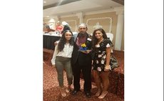 Bertrand with daughters Kylee and Kira at banquet