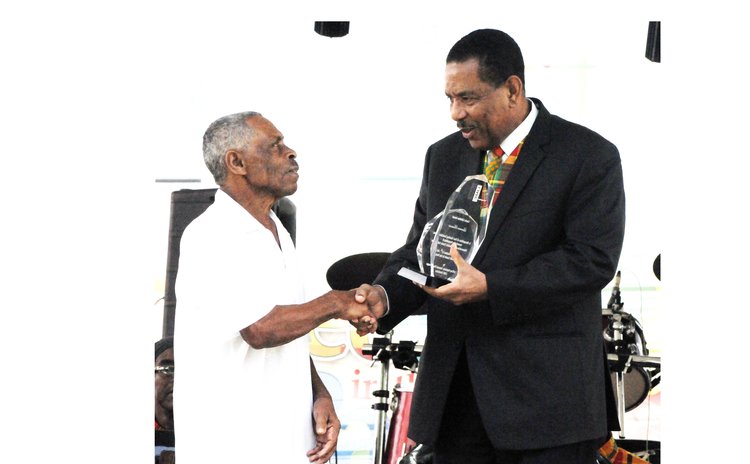 Lawrence Brumant, King of Konte, receives LIME Lifetime Award from President Savarin 