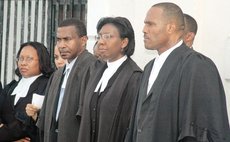 Michael Bruney, second from left, at an official opening of law year
