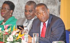 AID Bank Chairman Charles, Manager Corbett and other officials at the GM