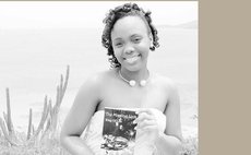 Chelsea Jno Baptiste shows her book