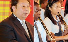Chinese Ambassador, left, and Chinese student playing in school band