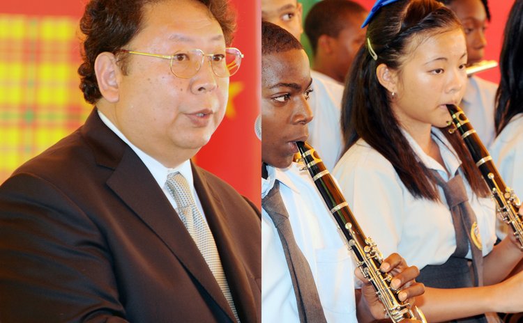 Chinese Ambassador, left, and Chinese student playing in school band
