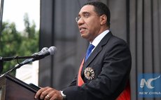             Jamaican Prime Minister Andrew Holness delivers an inaugural speech during his swearing-in ceremony at King's House in Kingston March 3, 2016. (Xinhua/Zhu Qingxiang)  