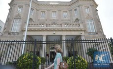 A pedestrian passes by the Cuba Interests Section on July 19, 2015 in Washington, DC. (Xinhua/AFP) 