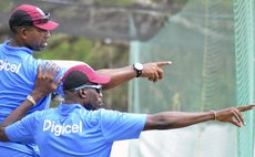 Coach Phil Simmons , left, and Bowling Coach Curtly Ambrose during a West Indies training session