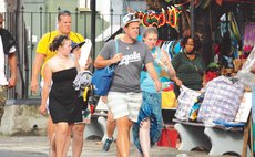 Cruise tourist walk on the Roseau Bayfront