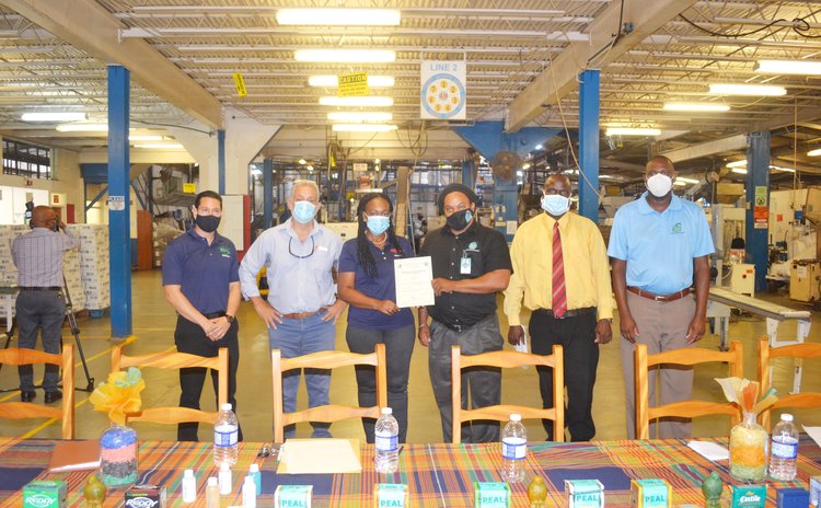 DCP gets new standards certificate: members of DCP staff and Dominica Bureau of Standards
