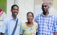 Ahmed Jno Baptiste, left, and parents