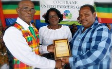 Lifetime Contribution to Agriculture Awarded to Mr. and Mrs. Oscar Francis by the group's President, William Sabaroche.