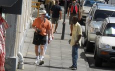 Vagrant and cruise ship passengers on the Roseau Bayfront