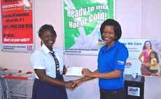 Jackson receives cheque from Save-a-lot official