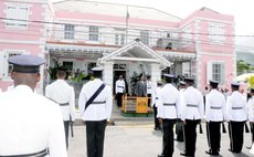 Police officers stand in front of the Dominica House of Assembly, Victoria Street, Roseau