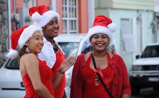 Three Kalinago beauties adorn  Roseau's streets on Christmas Eve