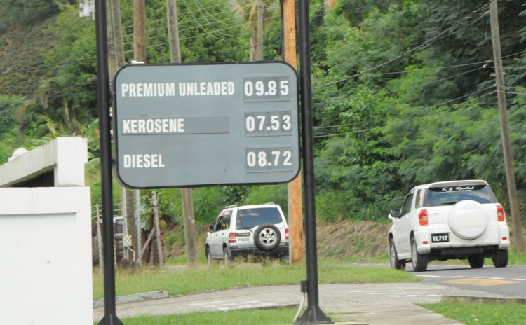 Sign showing prices of gas, kerosene and diesel outside NP gas station at Canefield