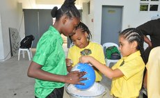 Children work on art at the NBD workshop