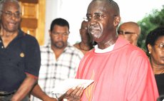 Father Franklyn Cuffy, right