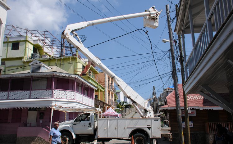DOMLEC tecnicians repair lines on Independence Street after hurricane Maria