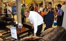 Trade Minister Collin McIntyre examines Ashley furniture at official launch of gallery